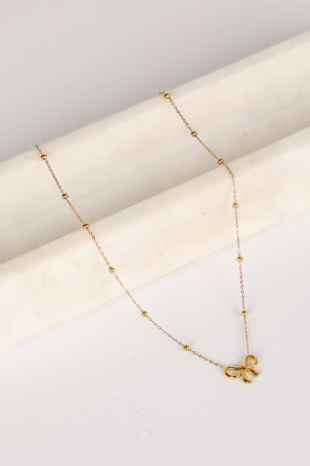 Elizabeth Gold Bow Charm Necklace - Image 4