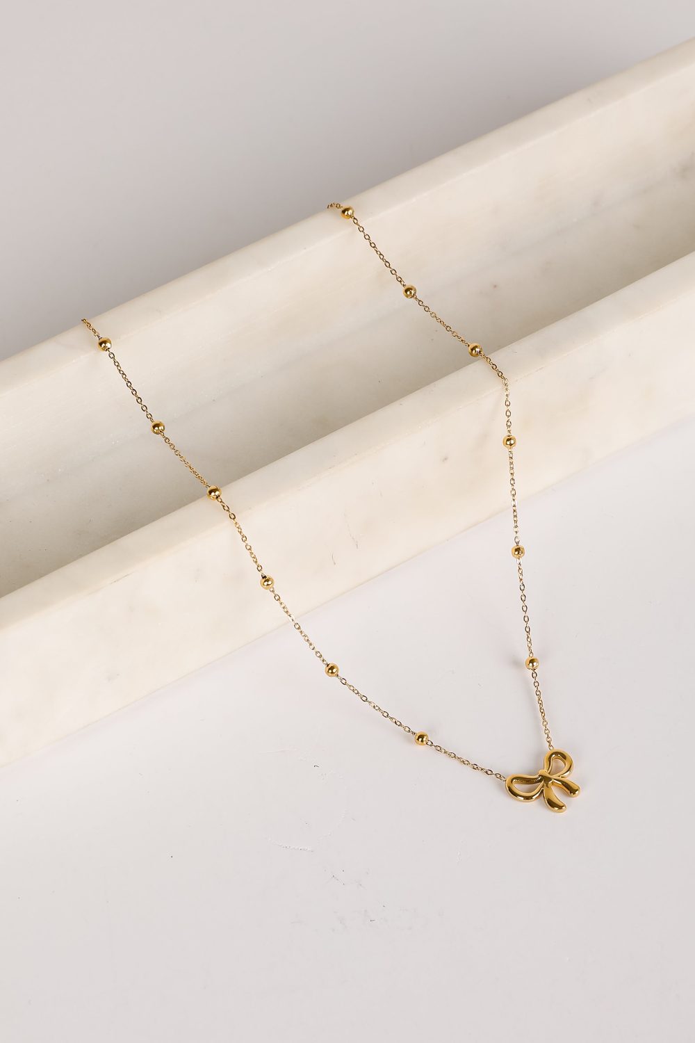 Elizabeth Gold Bow Charm Necklace - Image 3