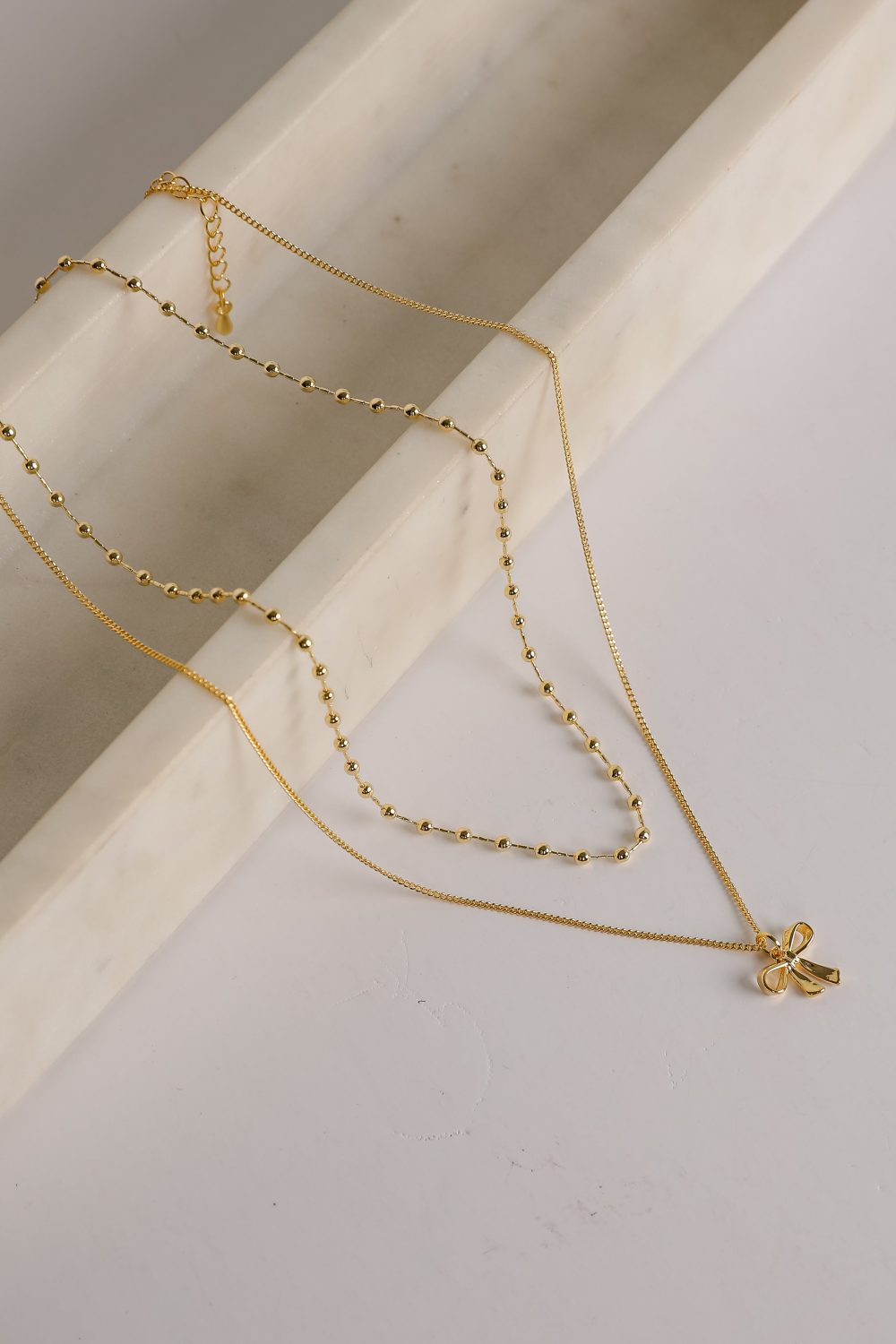 Allie Gold Layered Bow Charm Necklace - Image 3