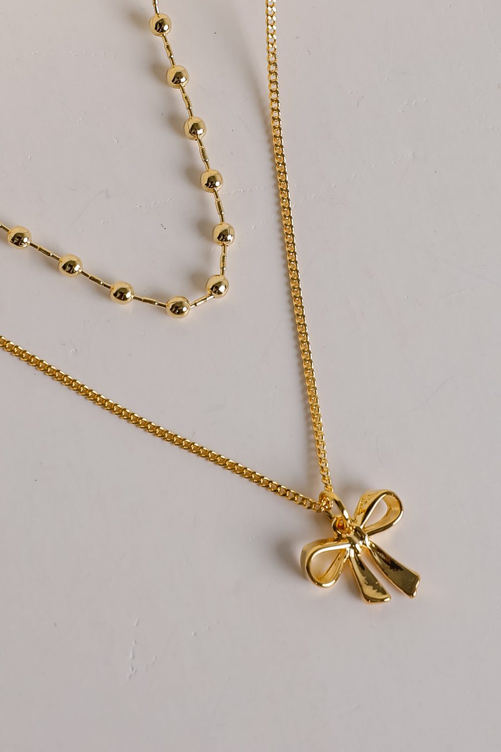 Allie Gold Layered Bow Charm Necklace - Image 2