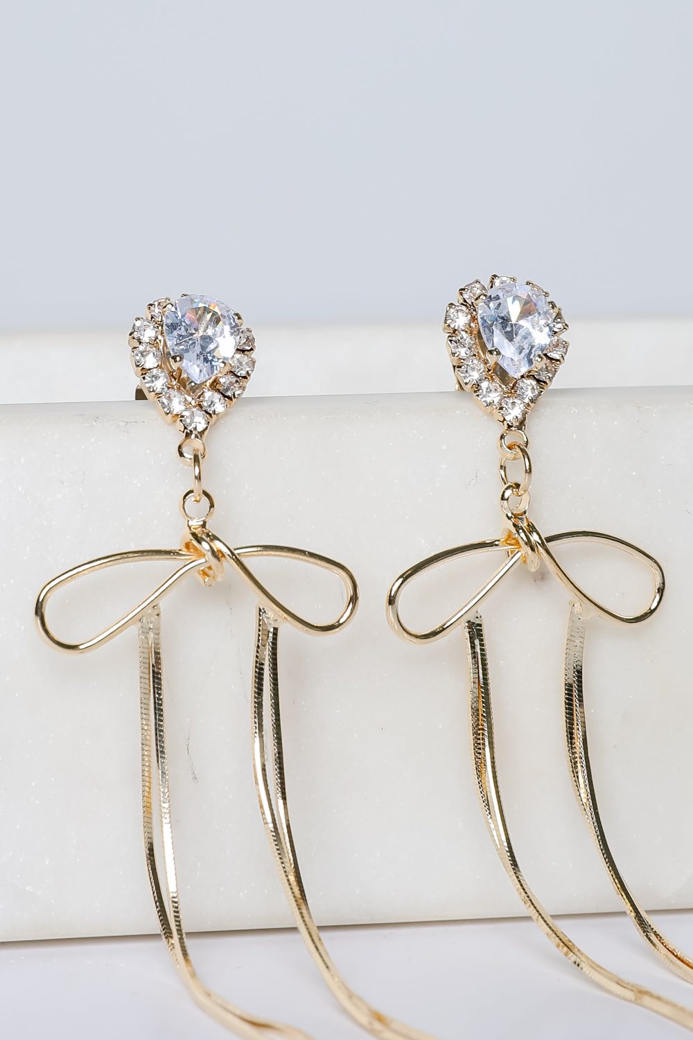 Lily Gold Rhinestone Bow Chain Drop Earrings - Image 2