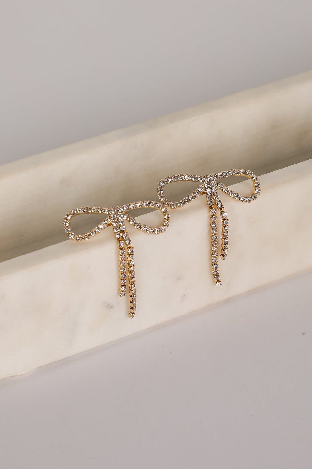 Kira Gold Rhinestone Bow Earrings - Image 2